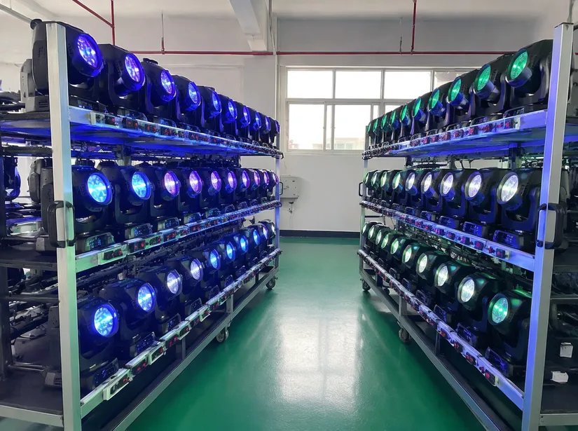 Stage lighting fixtures undergoing 48-hour burn-in testing on aging racks at GDMonkey factory