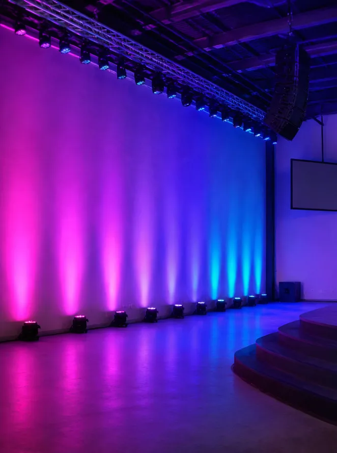 LED wash par fixture installed in a live venue showing ambient color wash coverage