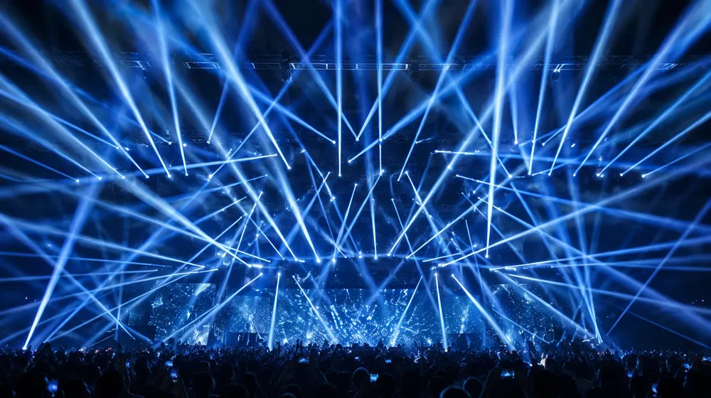 Beam moving head creating tight aerial beam effects through haze on concert stage