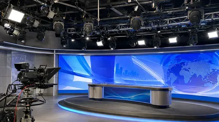 Spot and hybrid moving heads in a broadcast TV studio environment