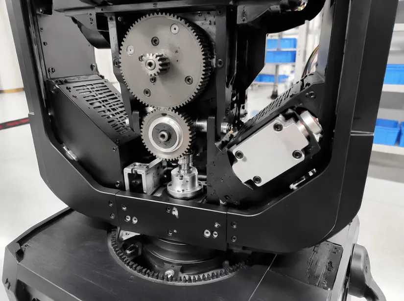 Moving head drive system engineering showing sintered metal gears and motor assembly