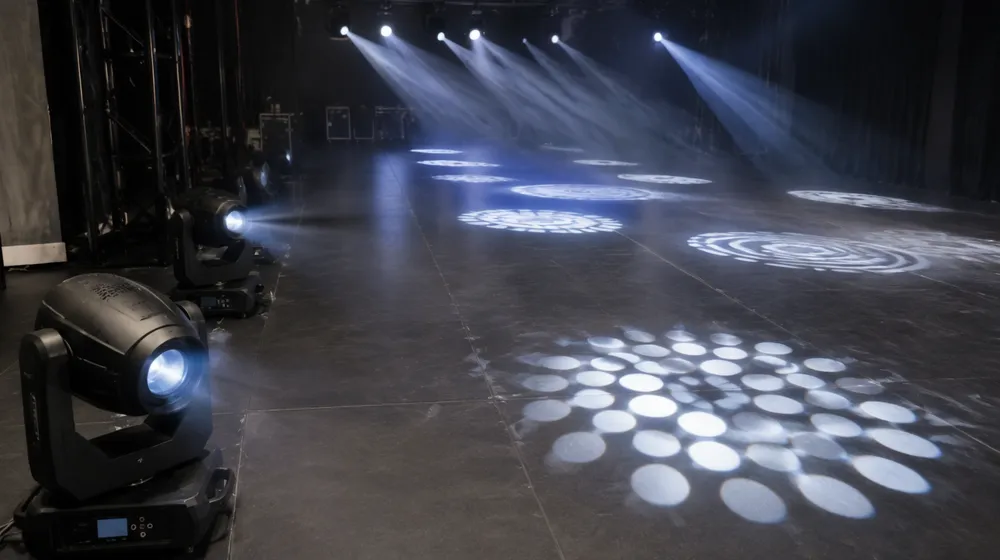 Spot moving head projecting gobo patterns on theatre stage surface