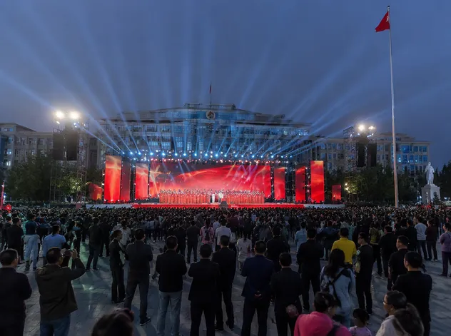 Municipal outdoor ceremony with professionally lit stage area using certified IP-rated fixtures
