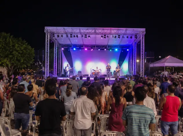 Outdoor worship event with RGBW par fixtures illuminating a community gathering stage