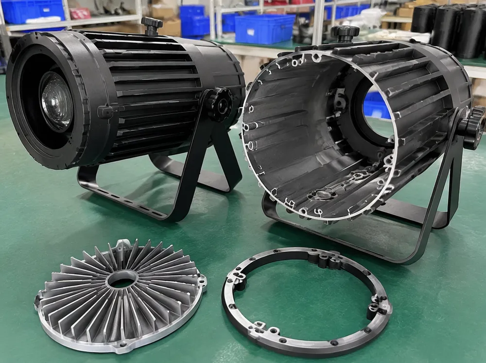Radial-rib aluminum housing on DJ pin spot showing 2.0mm wall thickness and internal ribbing for thermal dissipation at 3.2 kg total weight