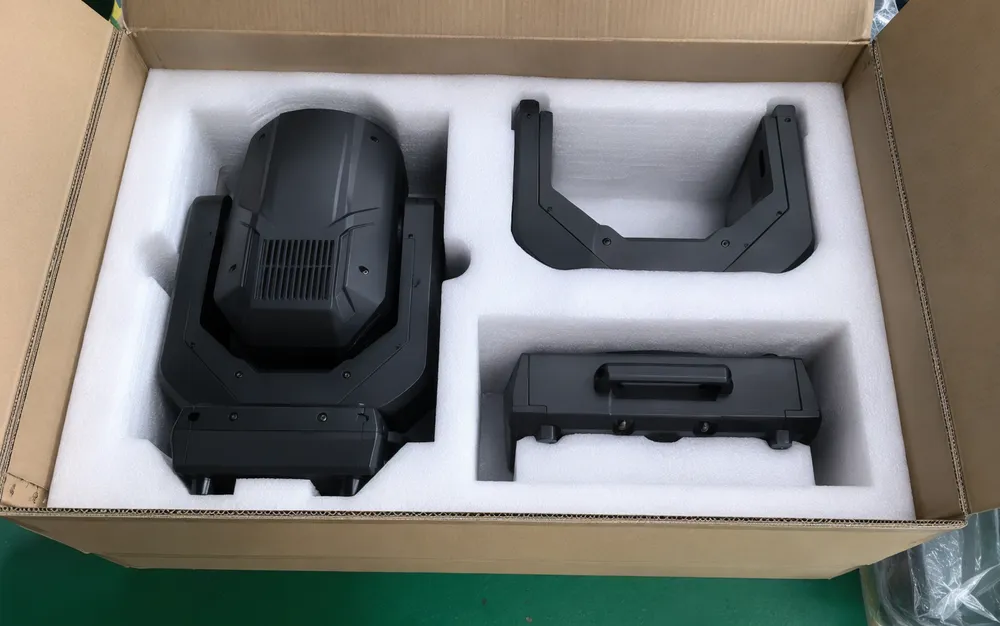 Custom-molded foam packaging with individual cavities for moving head spotlight head, yoke, and base