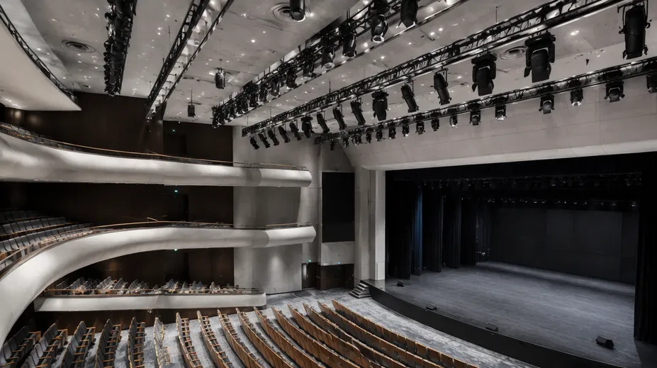 Multi-purpose civic auditorium with permanent profile spotlight rig for theatrical and concert use