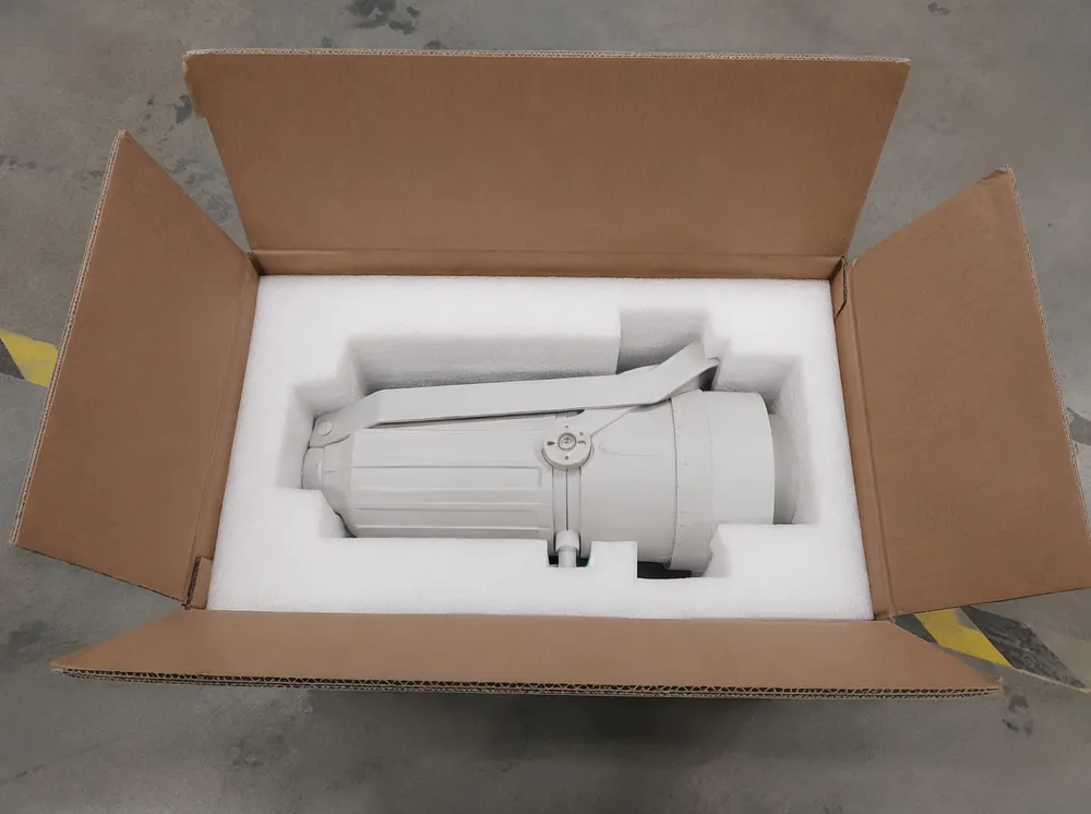CNC-cut molded foam packaging for warm white spotlight in corrugated master carton