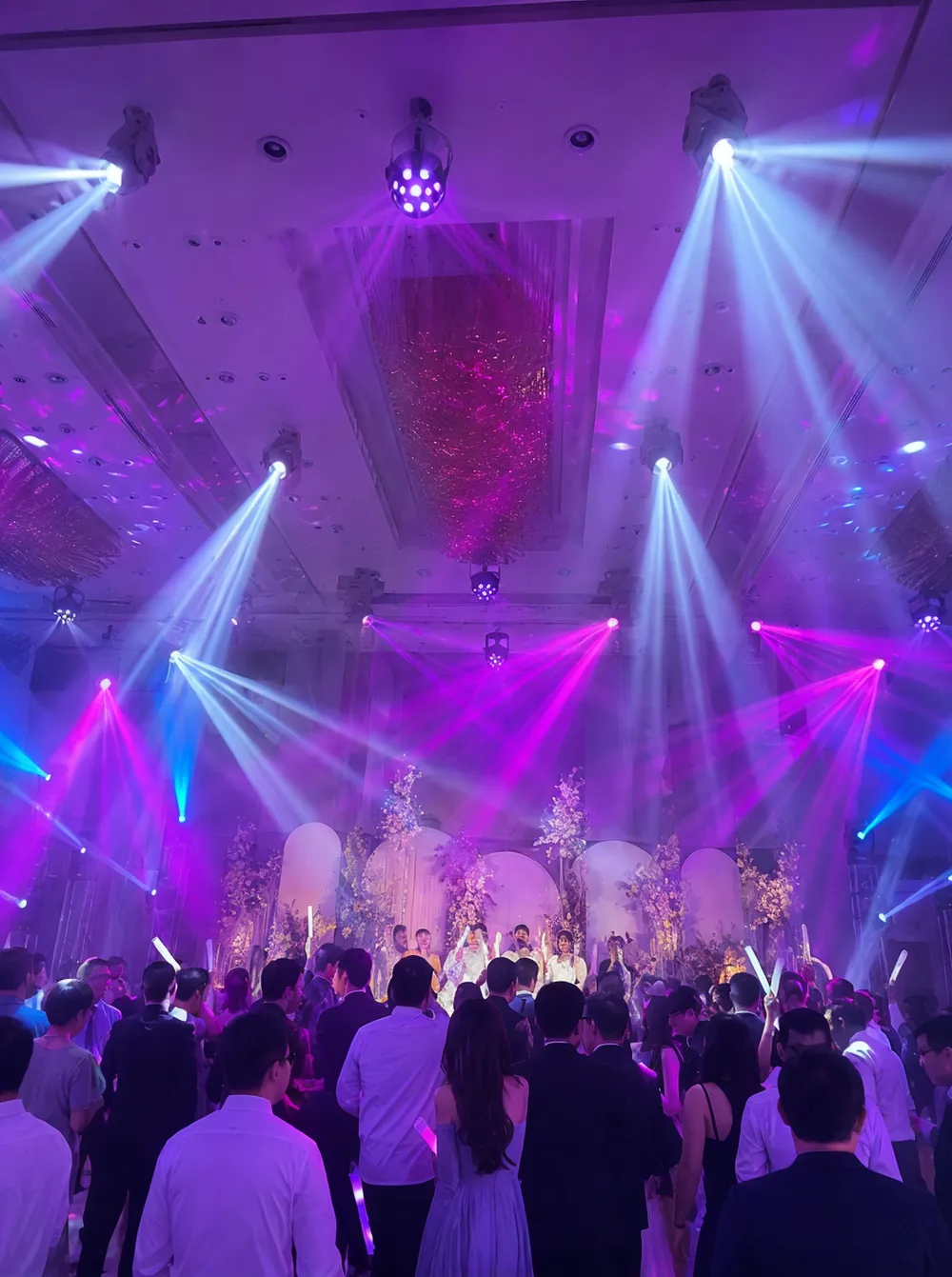 Beam moving heads and LED derby effects illuminating a wedding dance floor