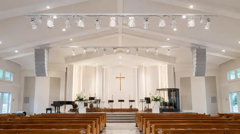 Permanent ceiling-mount lighting system in a church sanctuary serving worship and wedding ceremonies
