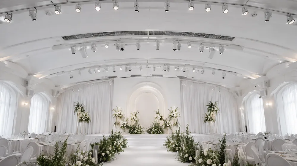 Architectural lighting rig permanently installed in a boutique wedding venue ballroom